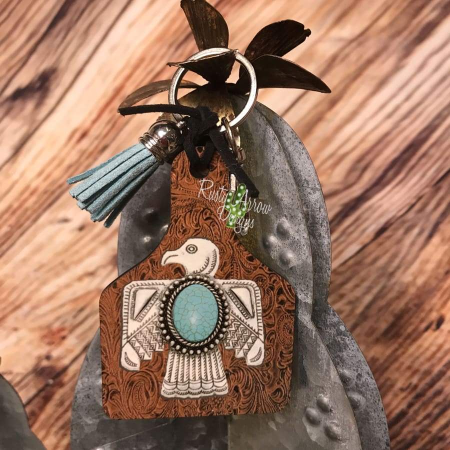 Leather background w/ Thunderbird Livestock Ear Tag Key chain