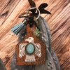 Leather background w/ Thunderbird Livestock Ear Tag Key chain